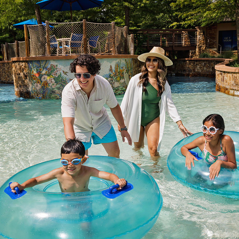 image of a family at the Lazy River at The Woodlands Resort
