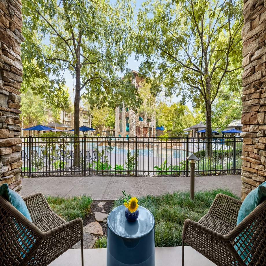 image of king room with walk out to pool at The Woodlands Resort
